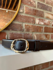 Dark brown leather belt with gold hardware buckle.