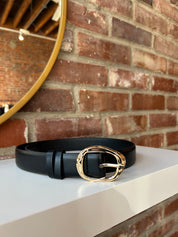 Dark brown leather belt with gold hardware buckle.