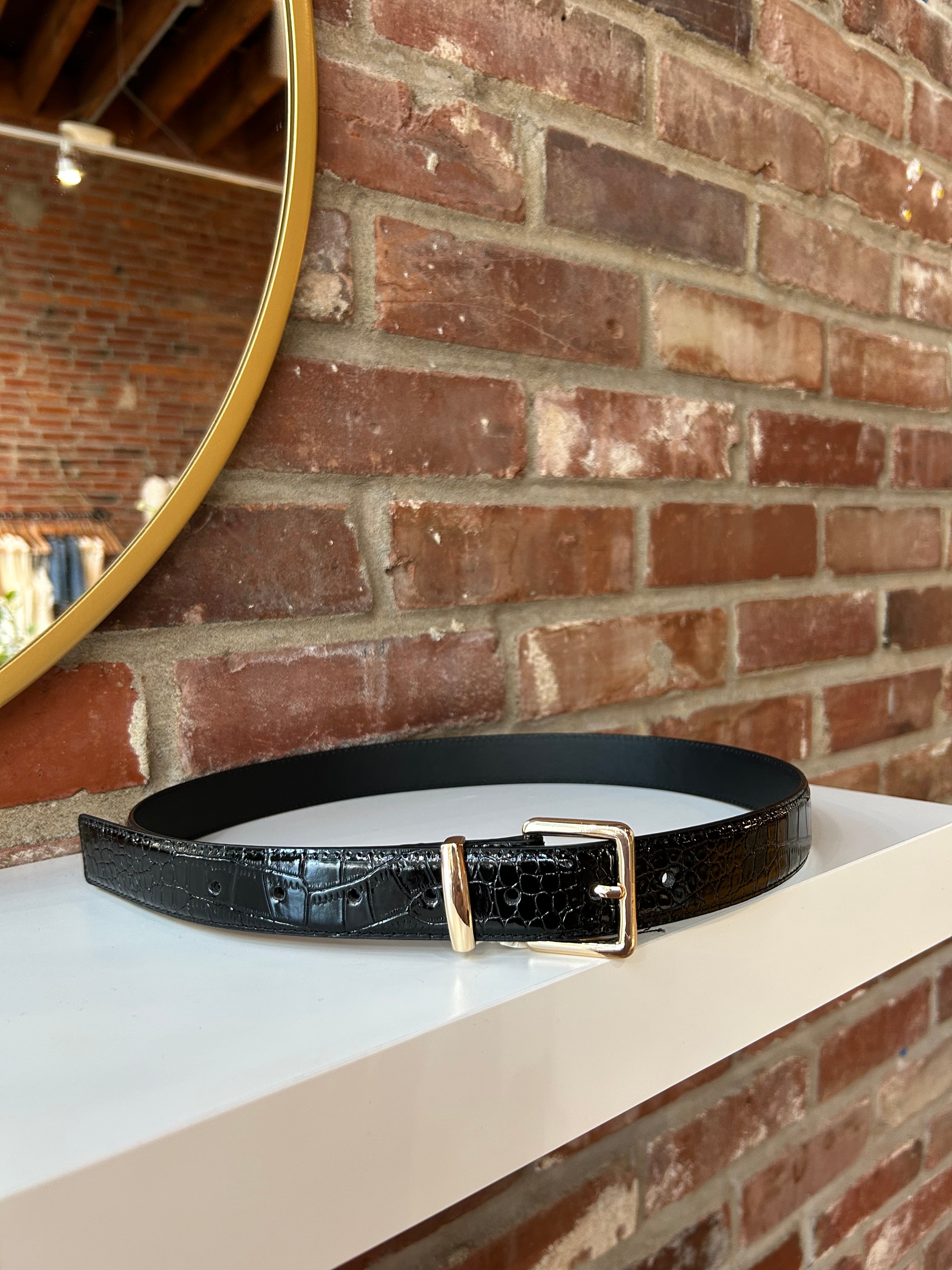 Black croc belt with gold buckle hardware.