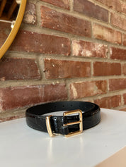 Black croc belt with gold buckle hardware.