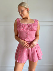 Red gingham two piece set with button detailing and pleated shorts.