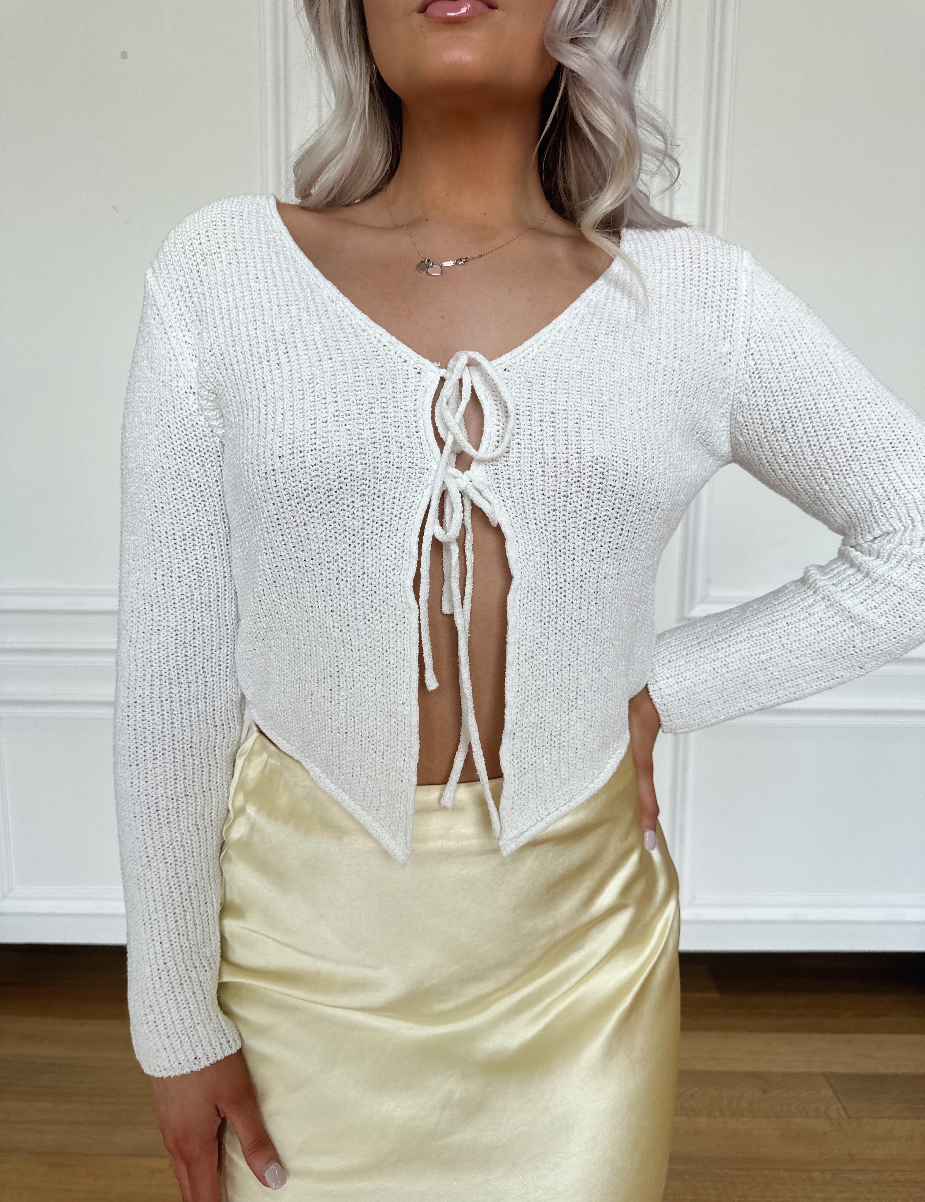 White knit long sleeve tie top. Perfect for spring and summer. 