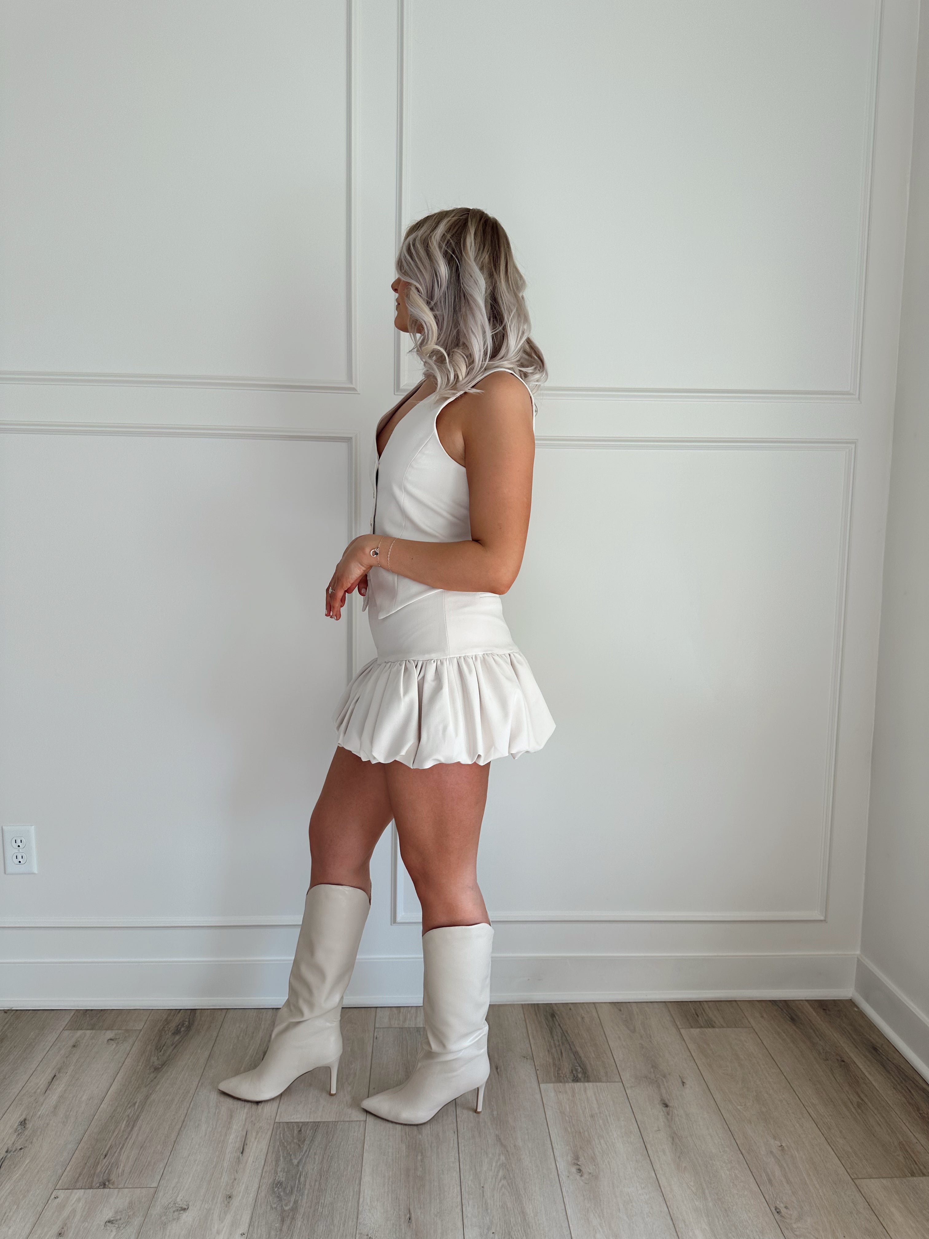 Cream ruffle hem mini skirt. Perfect for dressing up or down. 