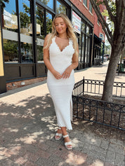 White crochet knit midi dress with open back and ruffle straps.