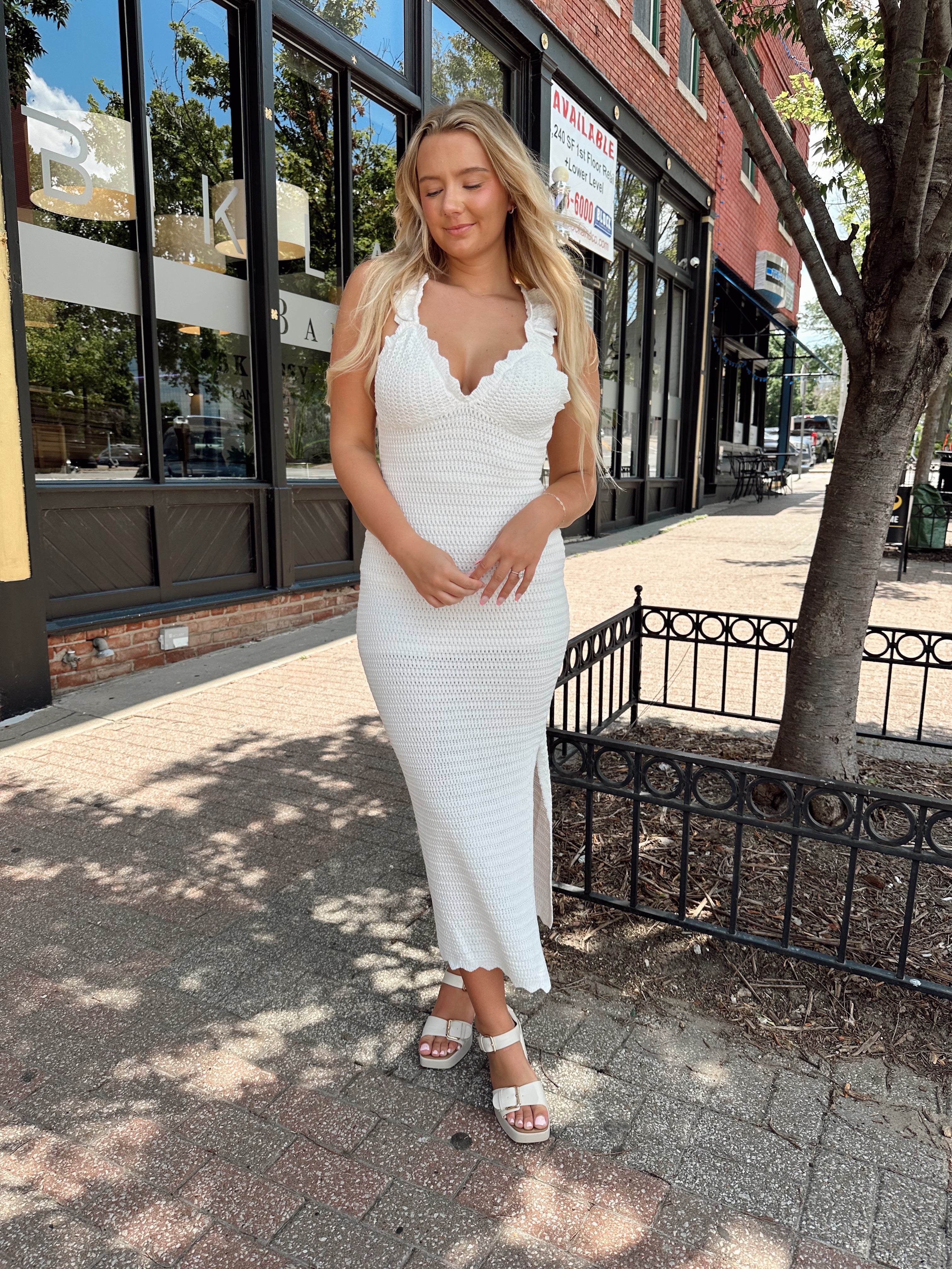 White crochet knit midi dress with open back and ruffle straps.