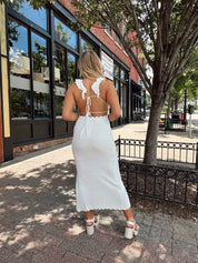White crochet knit midi dress with open back and ruffle straps.