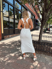 White crochet knit midi dress with open back and ruffle straps.