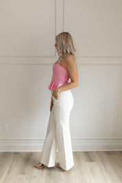 Pink strapless corset peplum top. Smocked back with hidden zipper.