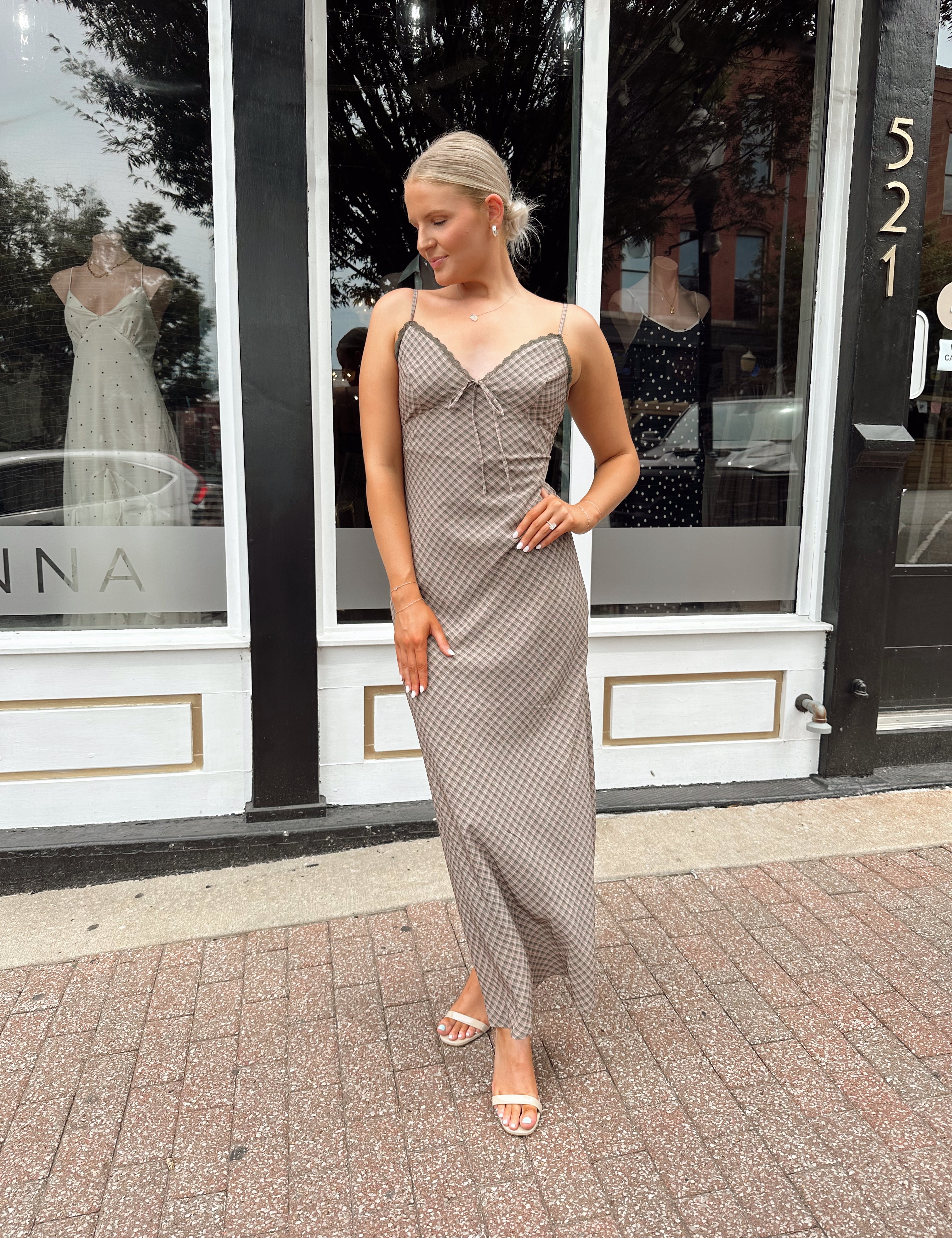 Brown plaid maxi dress with lace trim detail and tie.