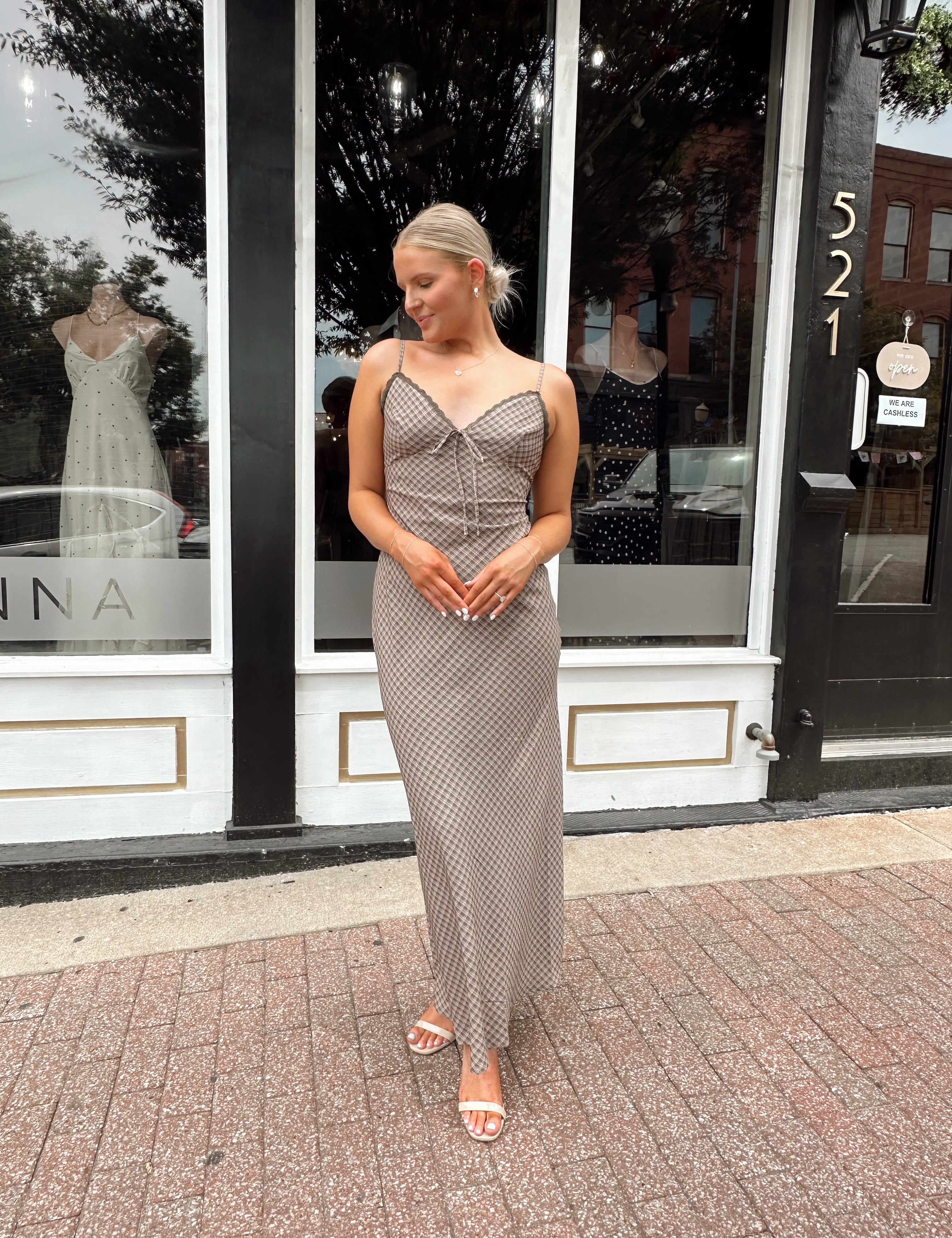 Brown plaid maxi dress with lace trim detail and tie.