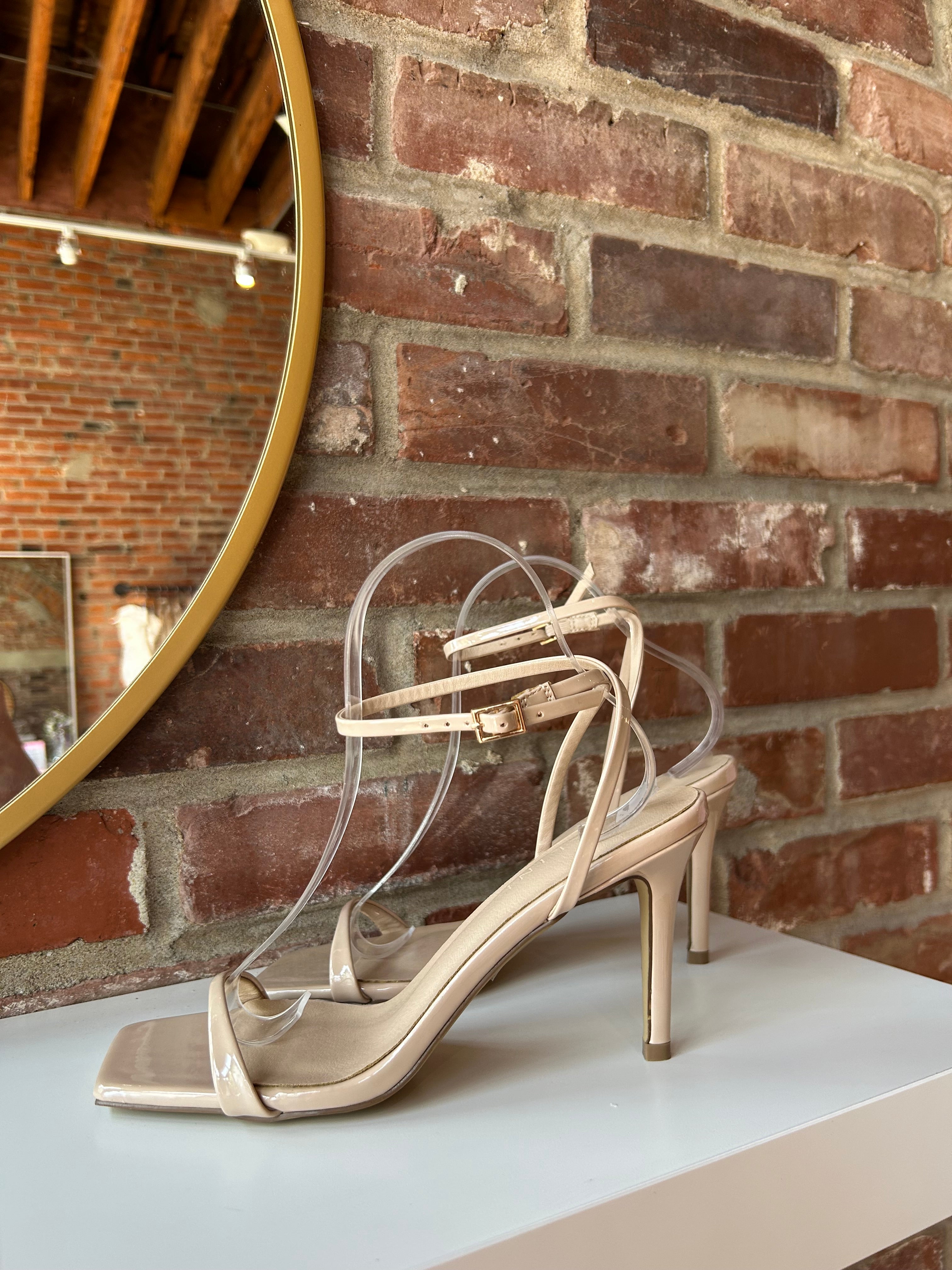 Nude stiletto sandal with square toe and nude ankle strap