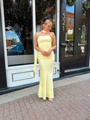 Butter yellow satin strapless maxi dress with detachable scarf.