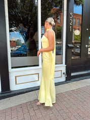 Butter yellow satin strapless maxi dress with detachable scarf.
