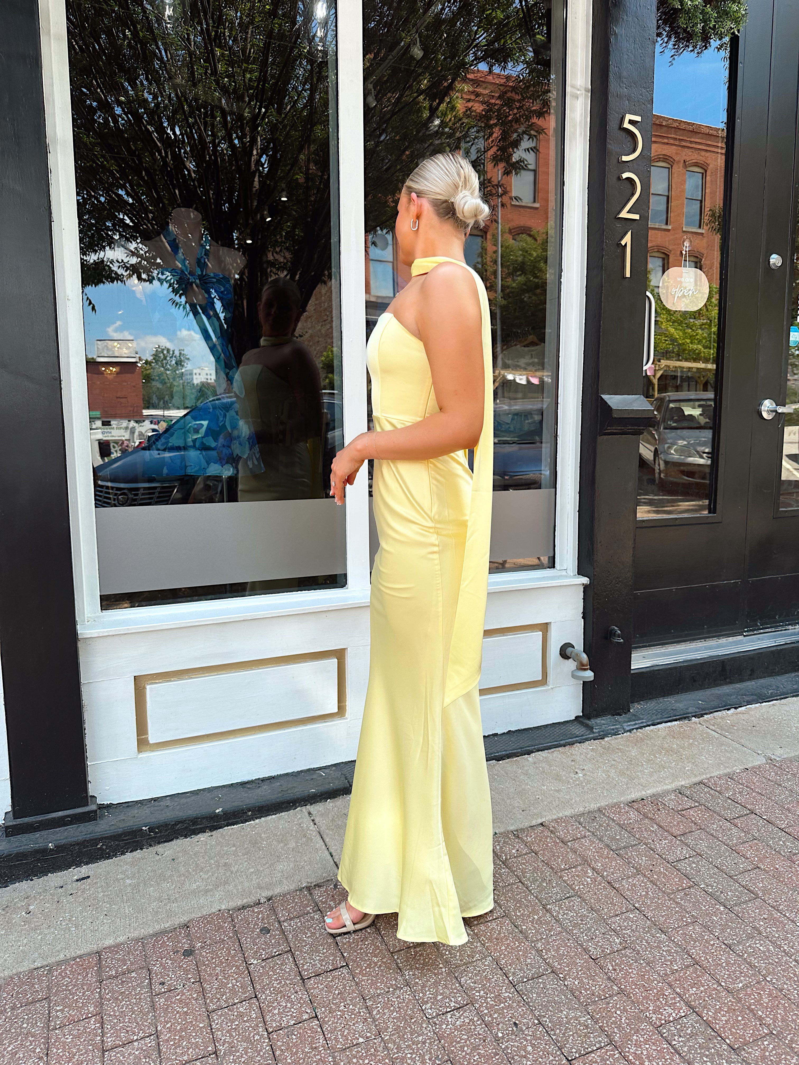 Butter yellow satin strapless maxi dress with detachable scarf.