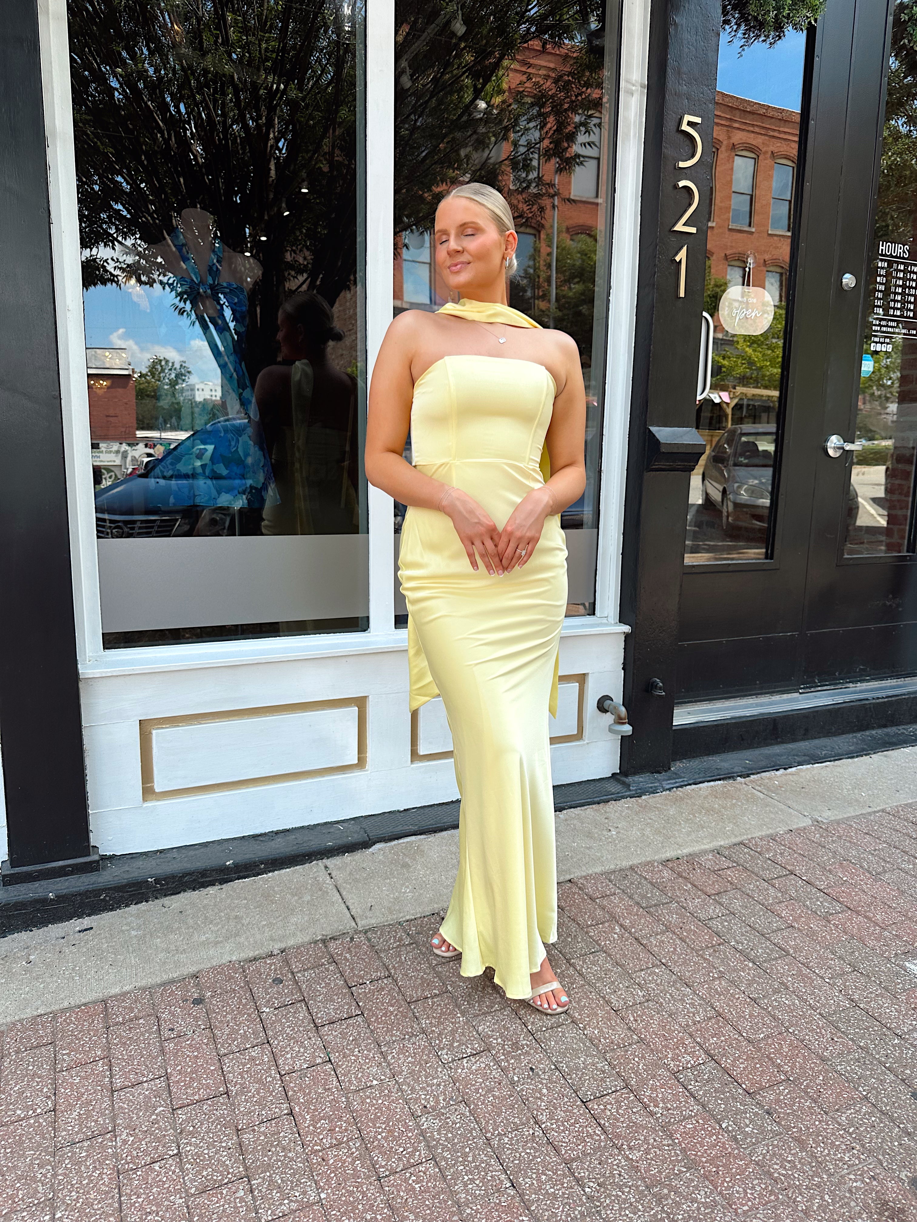 Butter yellow satin strapless maxi dress with detachable scarf.