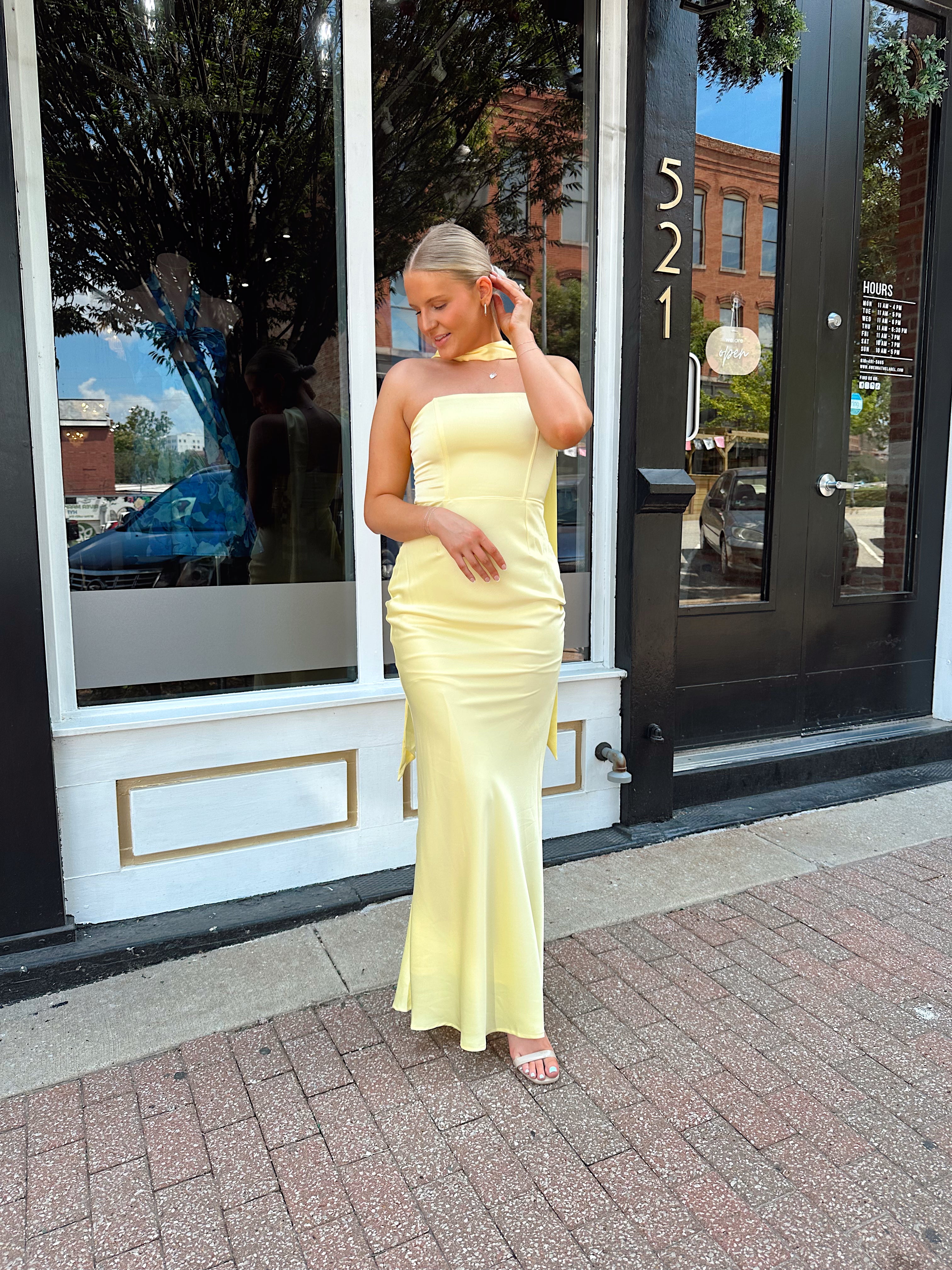 Butter yellow satin strapless maxi dress with detachable scarf.