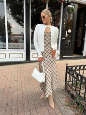Off white knit cardigan with iridescent button detailing.