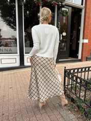Off white knit cardigan with iridescent button detailing.