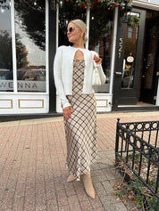 Off white knit cardigan with iridescent button detailing.