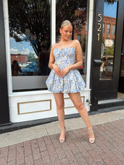 Blue floral bustier mini dress with bubble hem and tie detail.