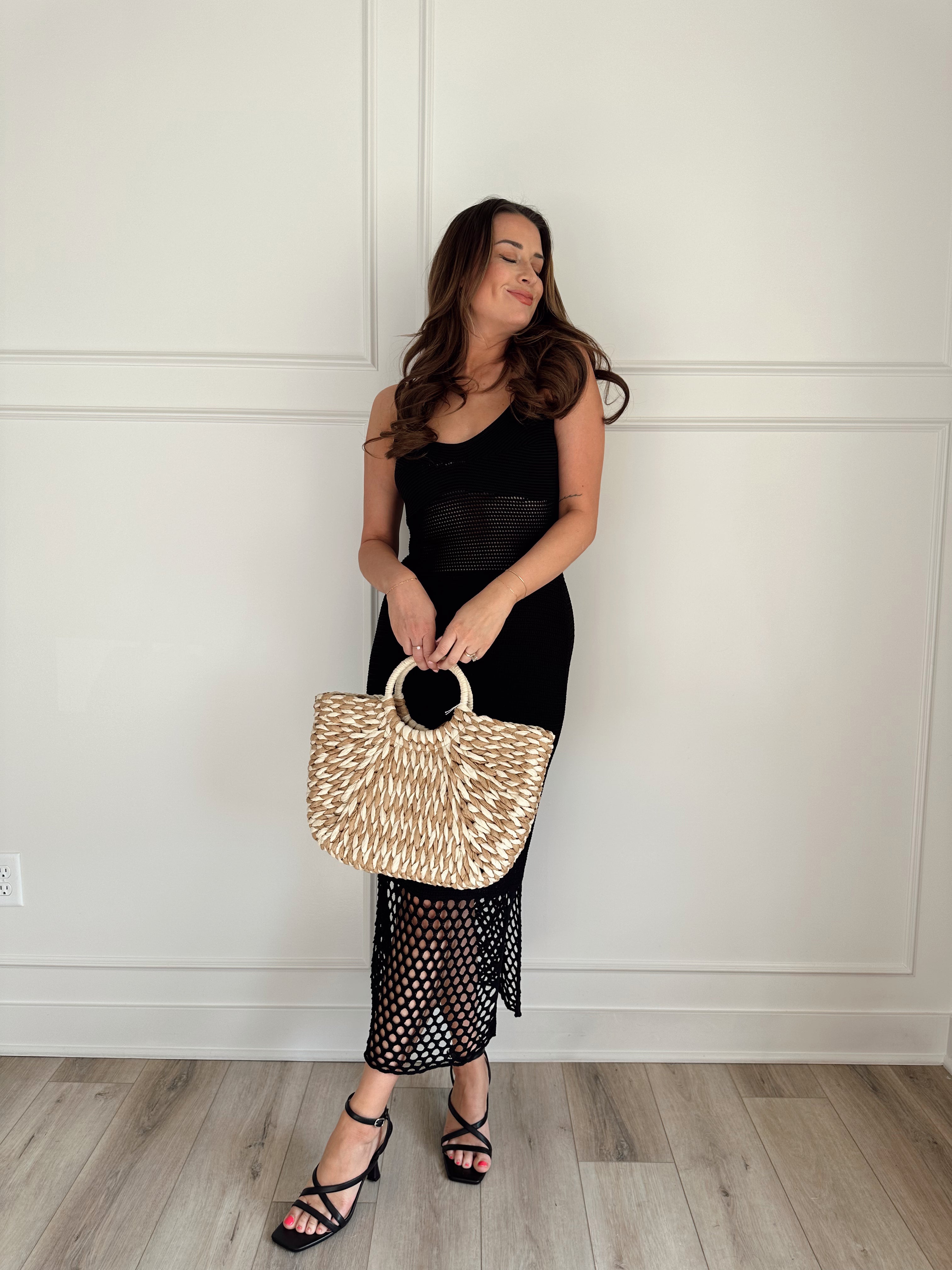 Black knit midi dress with slits up the side. Also comes in cream and blue. 