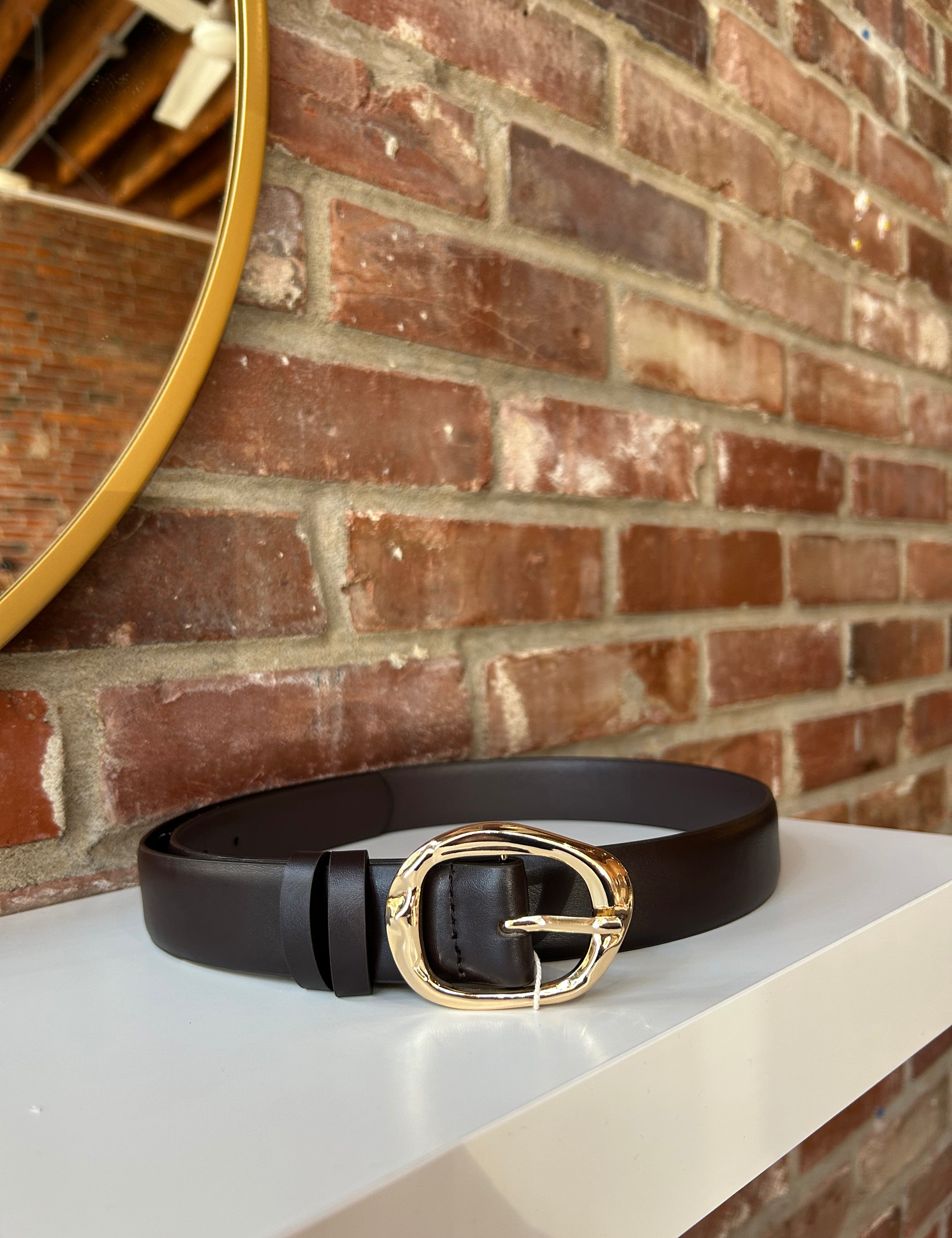 Dark brown leather belt with gold hardware buckle.