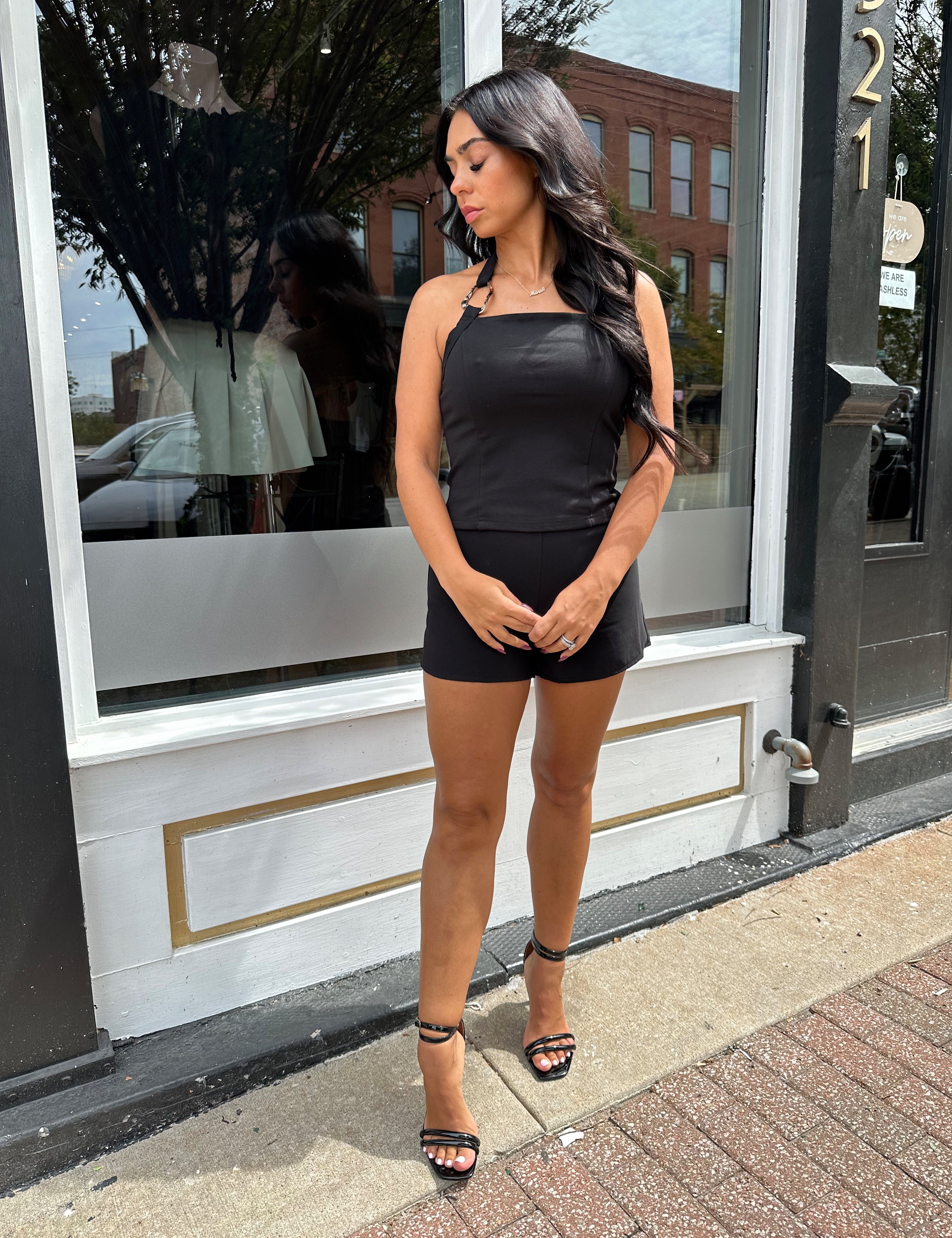 Woman wearing black tailored shorts. 