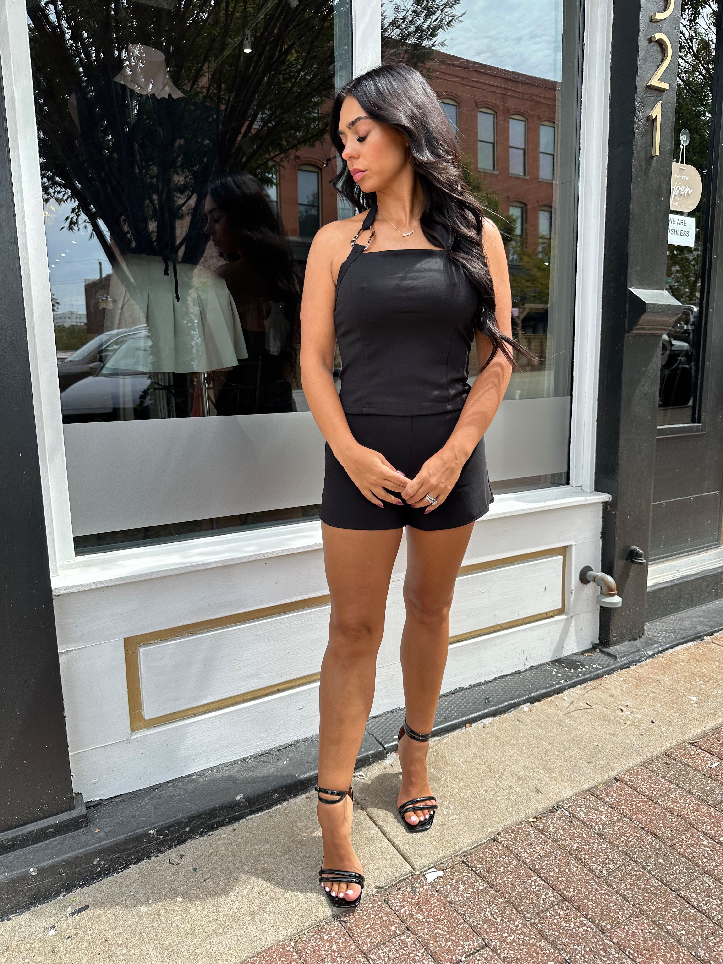 Woman wearing black tailored shorts. 