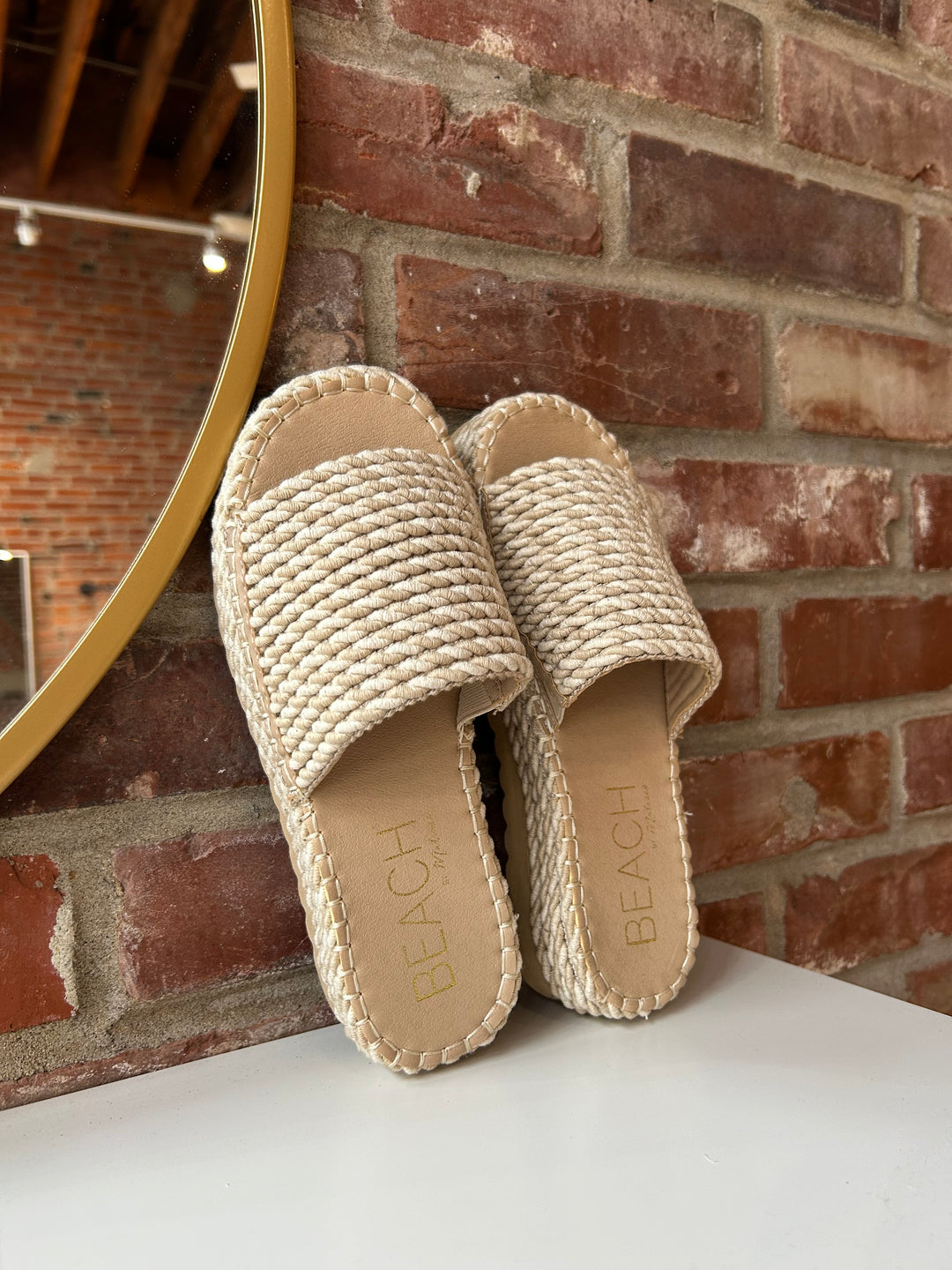 Cairo woven platform slide sandals with natural rope sole and textured woven upper.