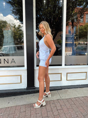 Blue textured two piece set with button detail shorts and tie top.