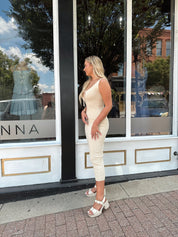 Ivory colored ribbed midi dress with cutout detail.