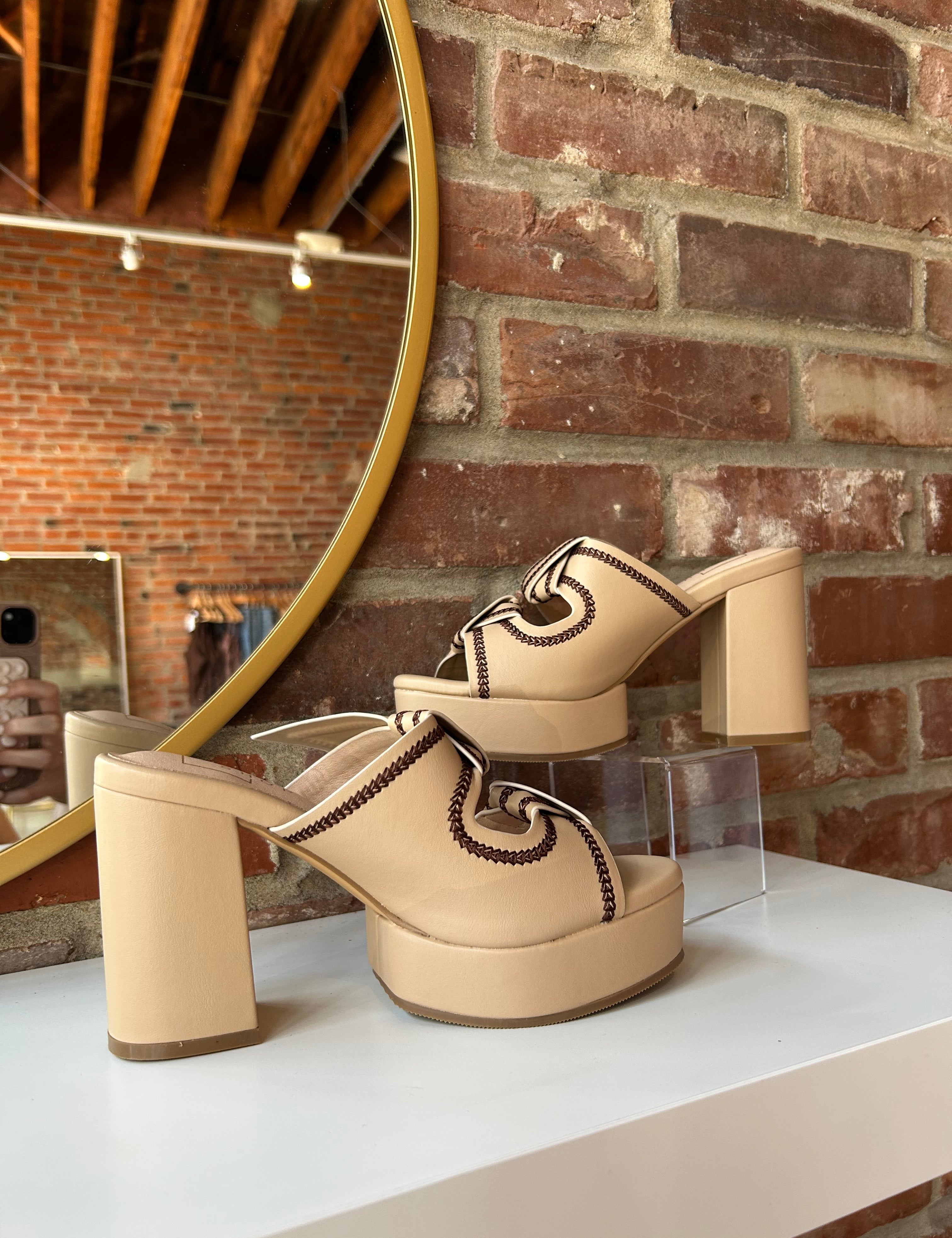 Tan platform heel with dark brown stitching and bow detail.