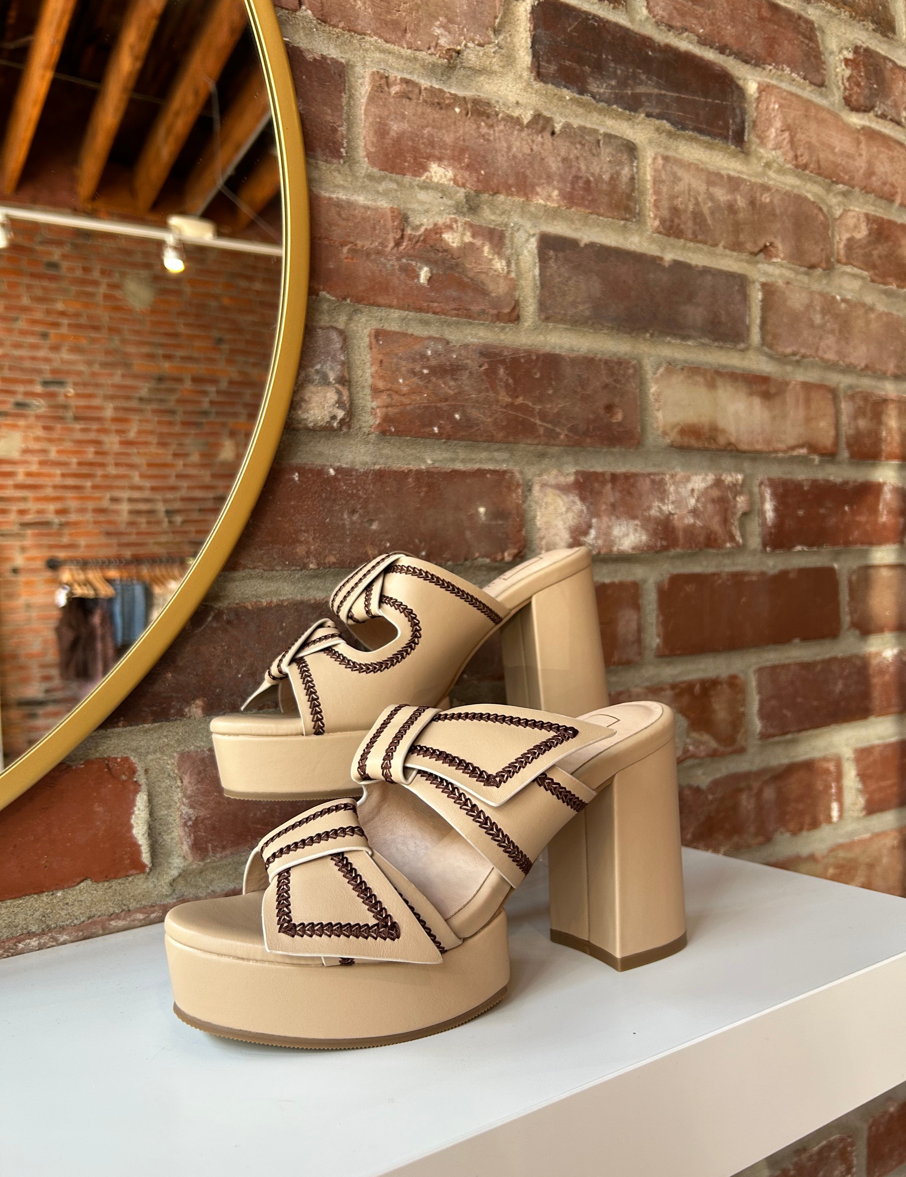 Tan platform heel with dark brown stitching and bow detail.