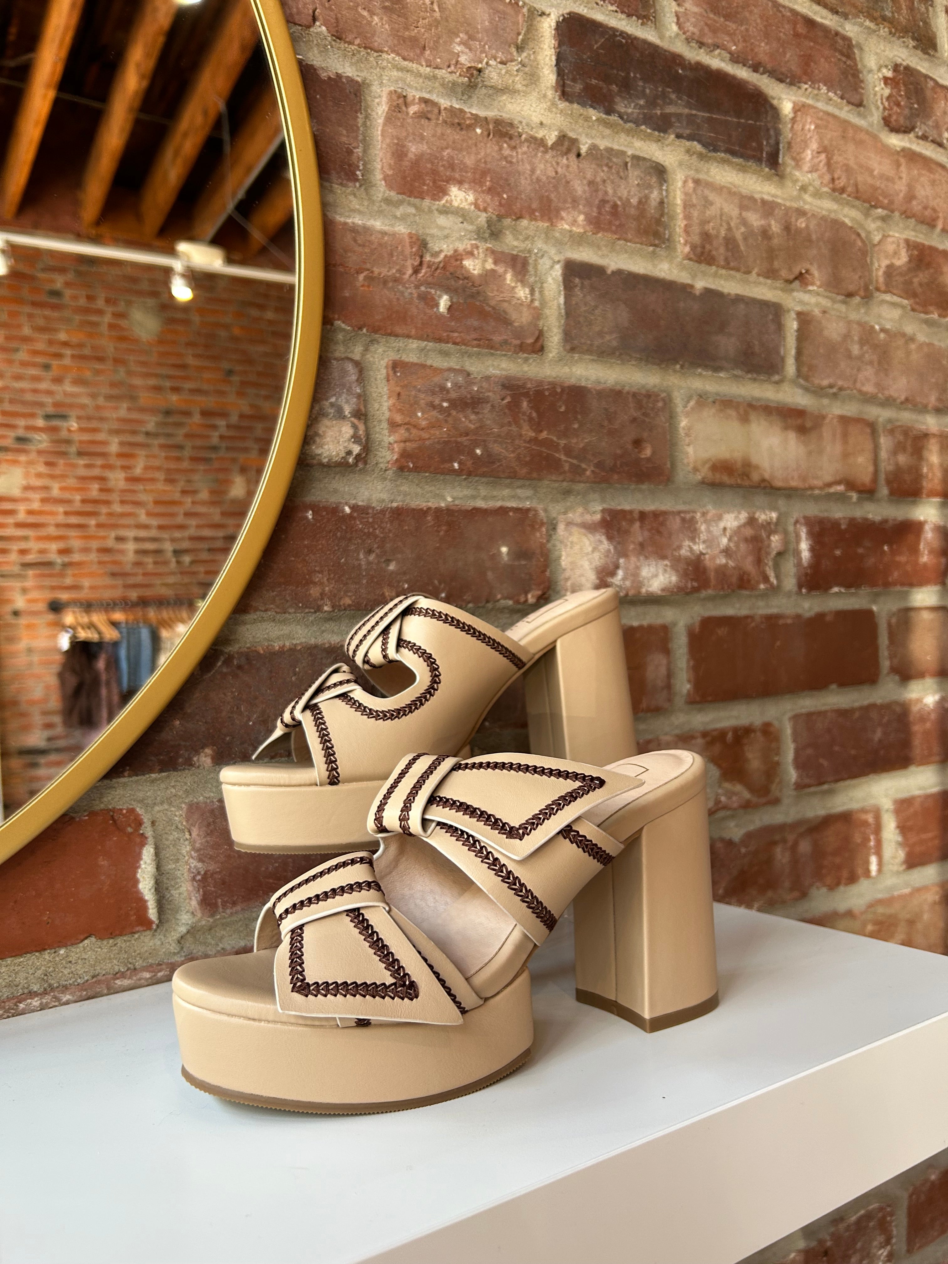 Tan platform heel with dark brown stitching and bow detail.