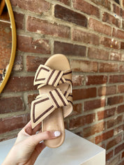 Tan platform heel with dark brown stitching and bow detail.