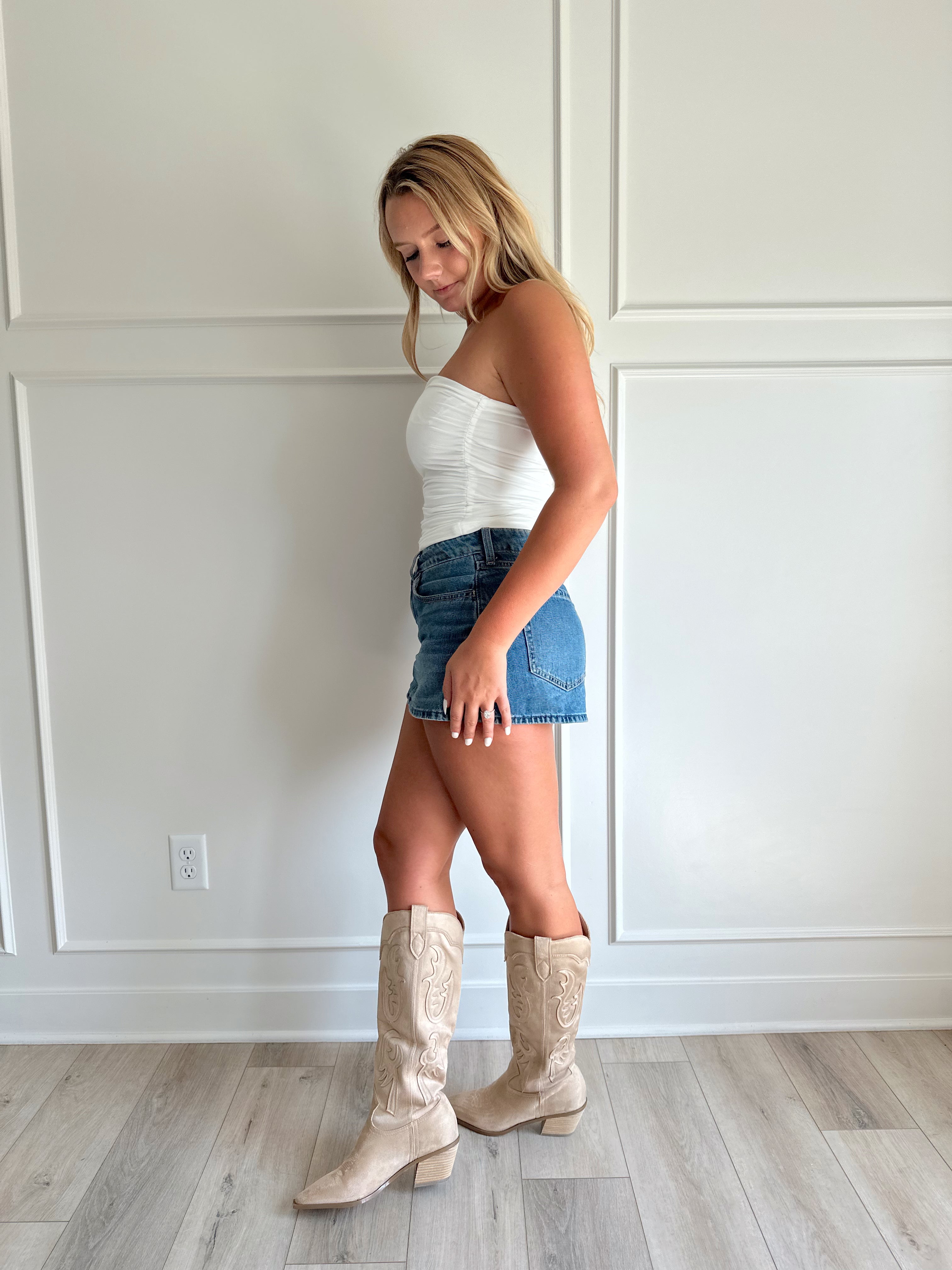 White tube top with shimmer finish and ruched sides.