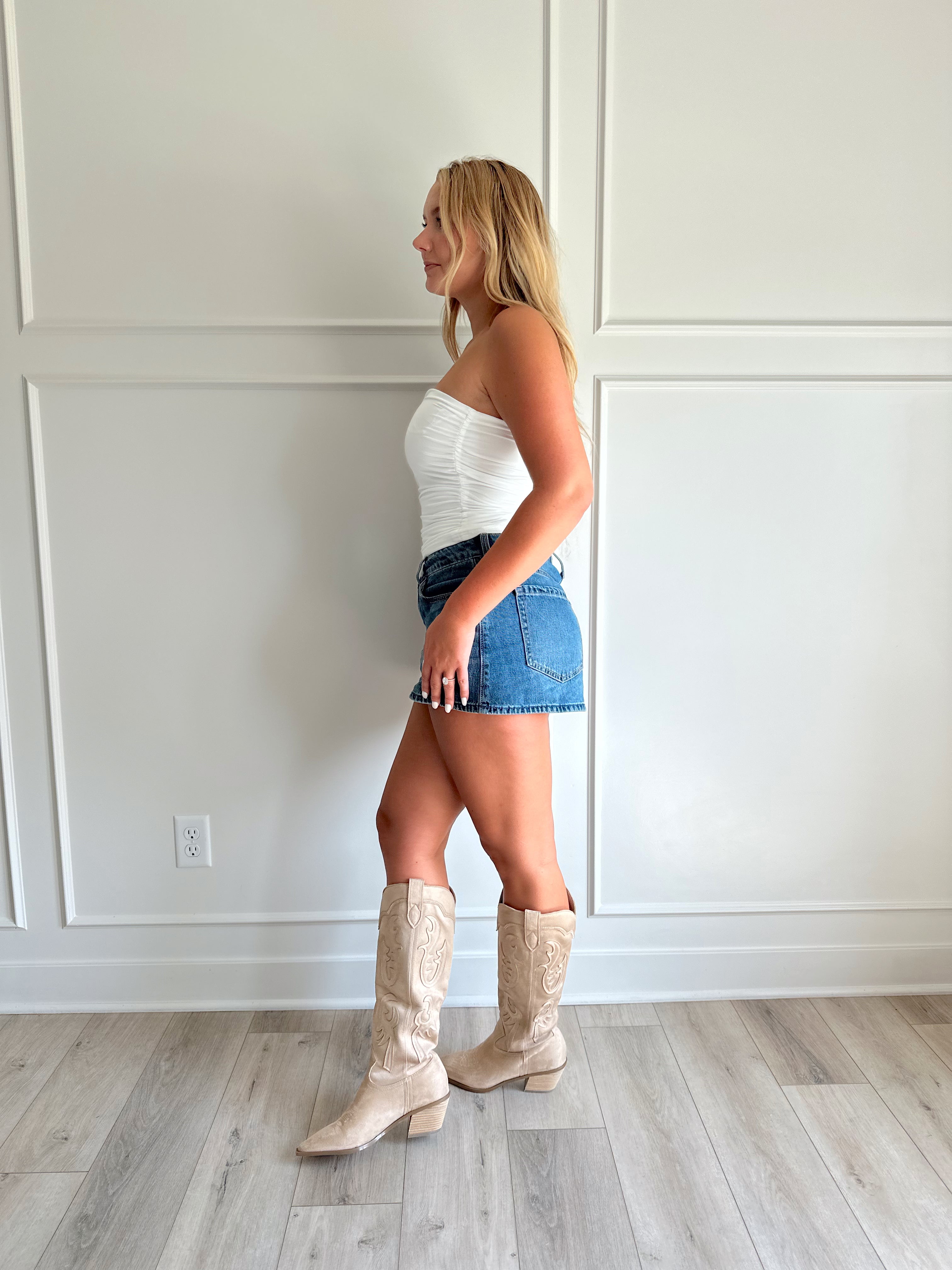 White tube top with shimmer finish and ruched sides.