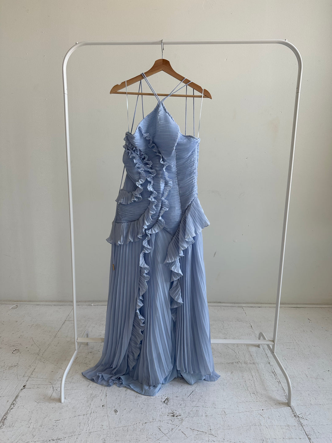 Blue chiffon textured midi dress with halter neckline.