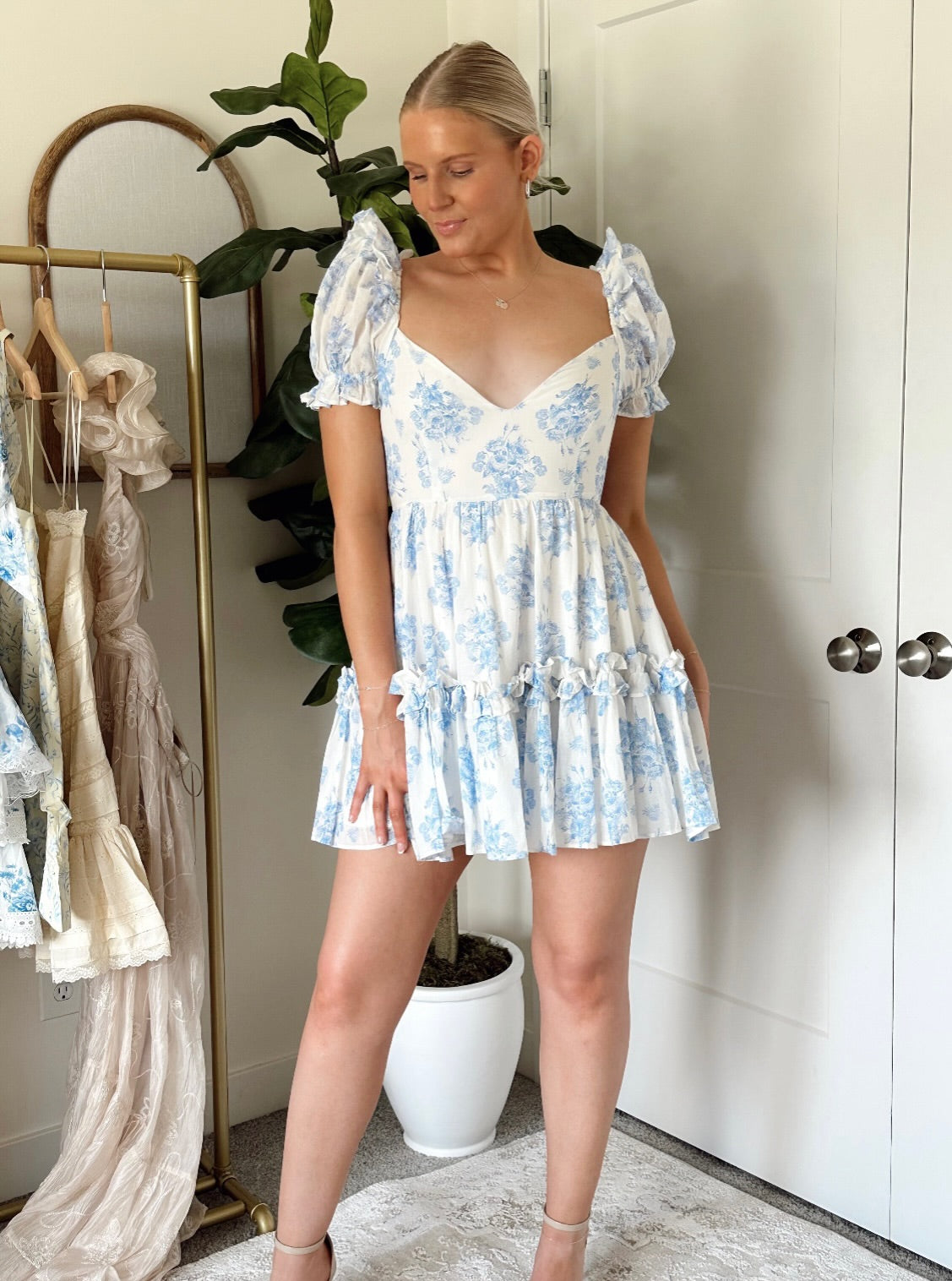 Blue and white floral mini dress with v neckline and puff sleeve. 