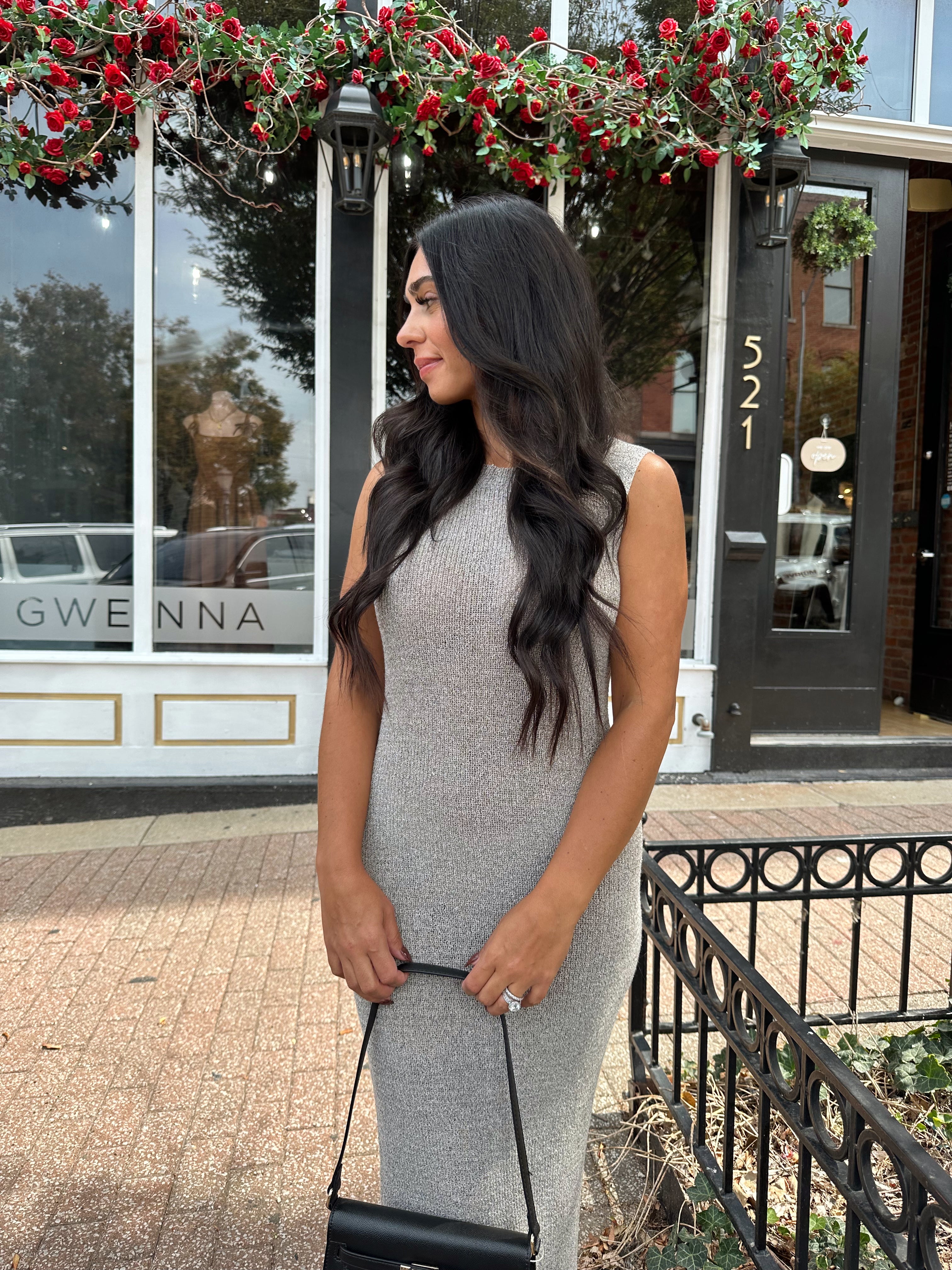 Woman wearing grey knit high neck maxi dress. Plenty of stretch. 