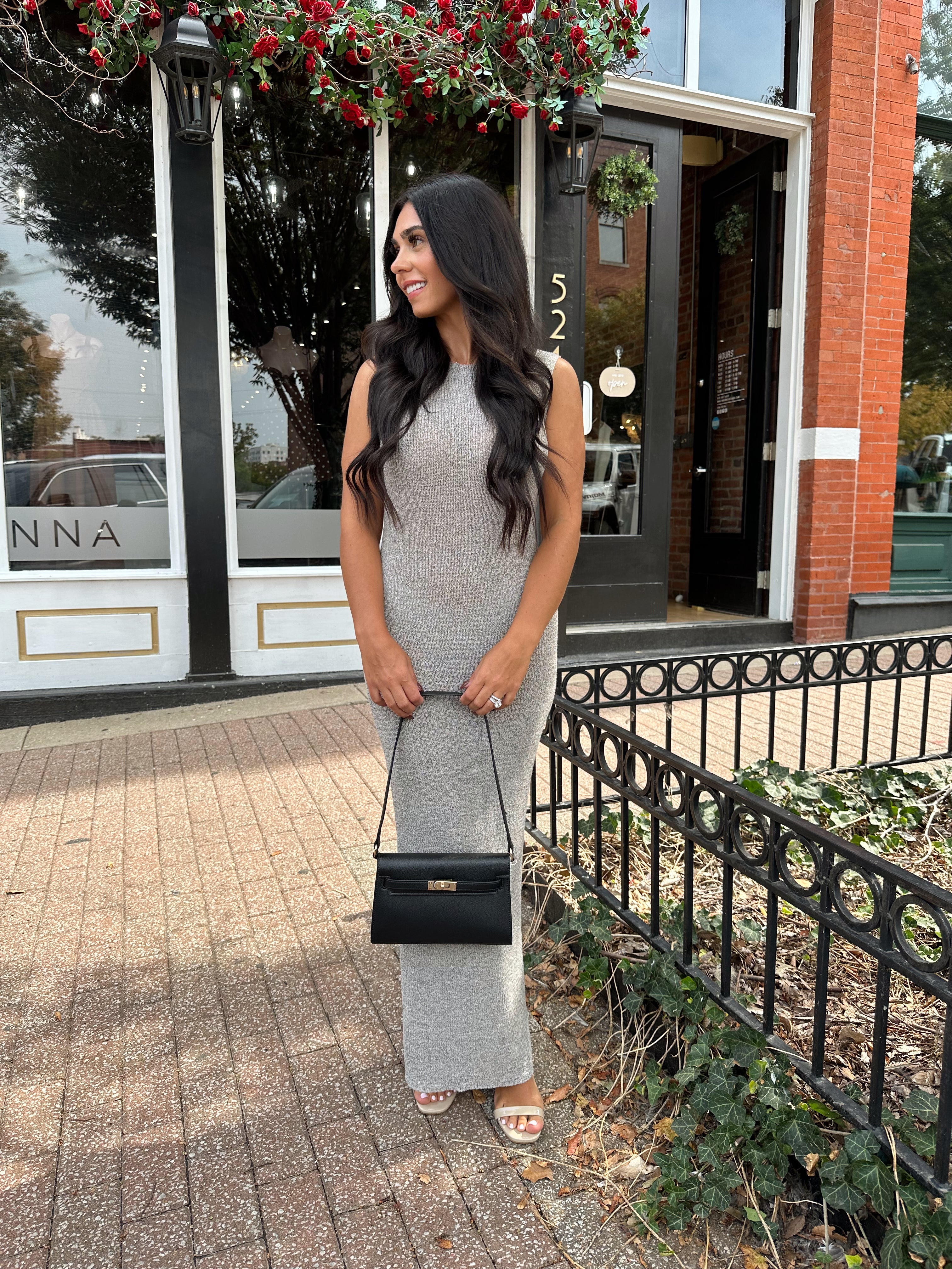Woman wearing grey knit high neck maxi dress. Plenty of stretch. 