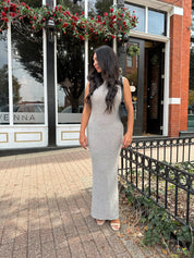 Woman wearing grey knit high neck maxi dress. Plenty of stretch. 