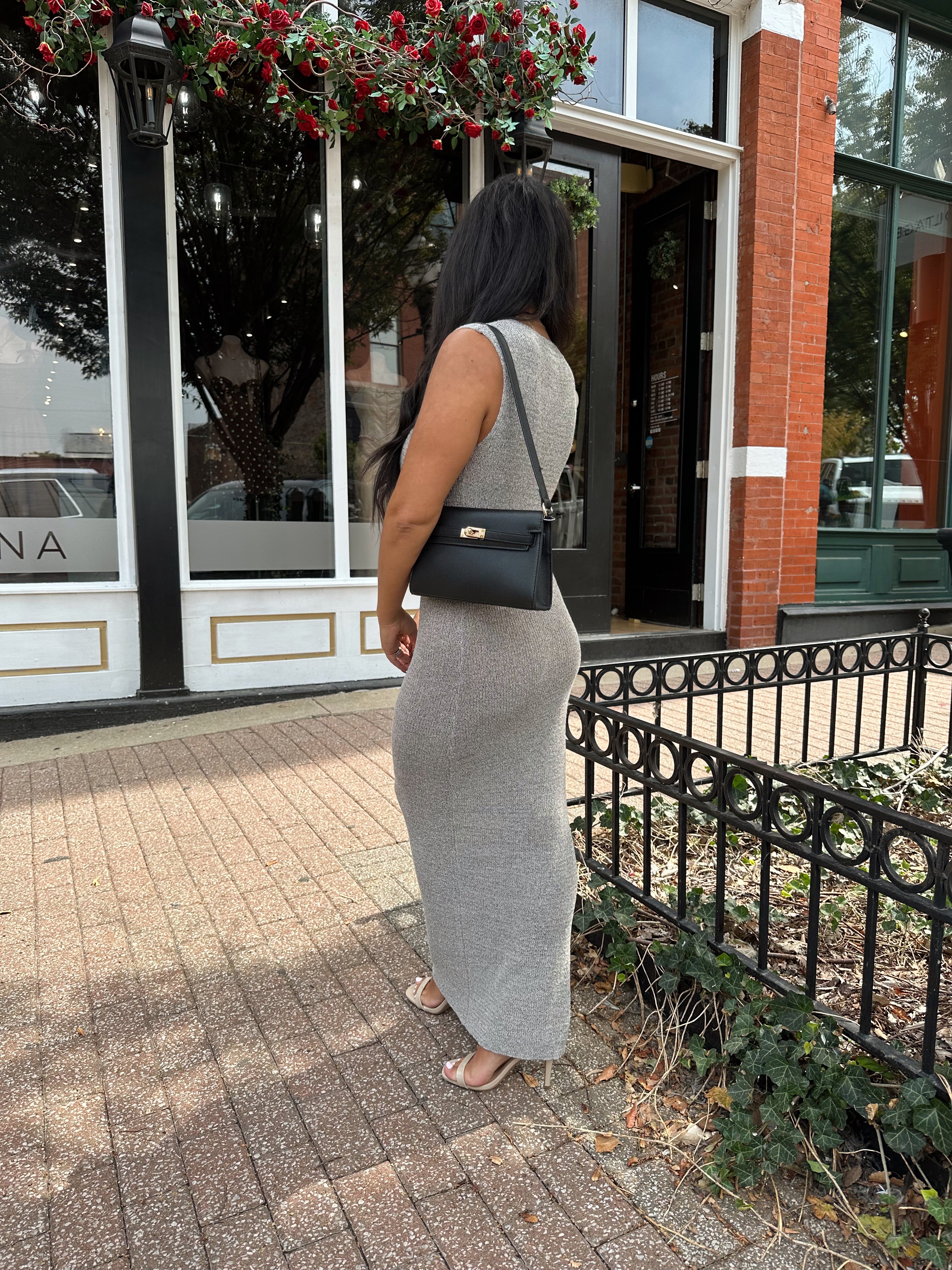 Woman wearing grey knit high neck maxi dress. Plenty of stretch. 
