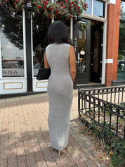 Woman wearing grey knit high neck maxi dress. Plenty of stretch. 