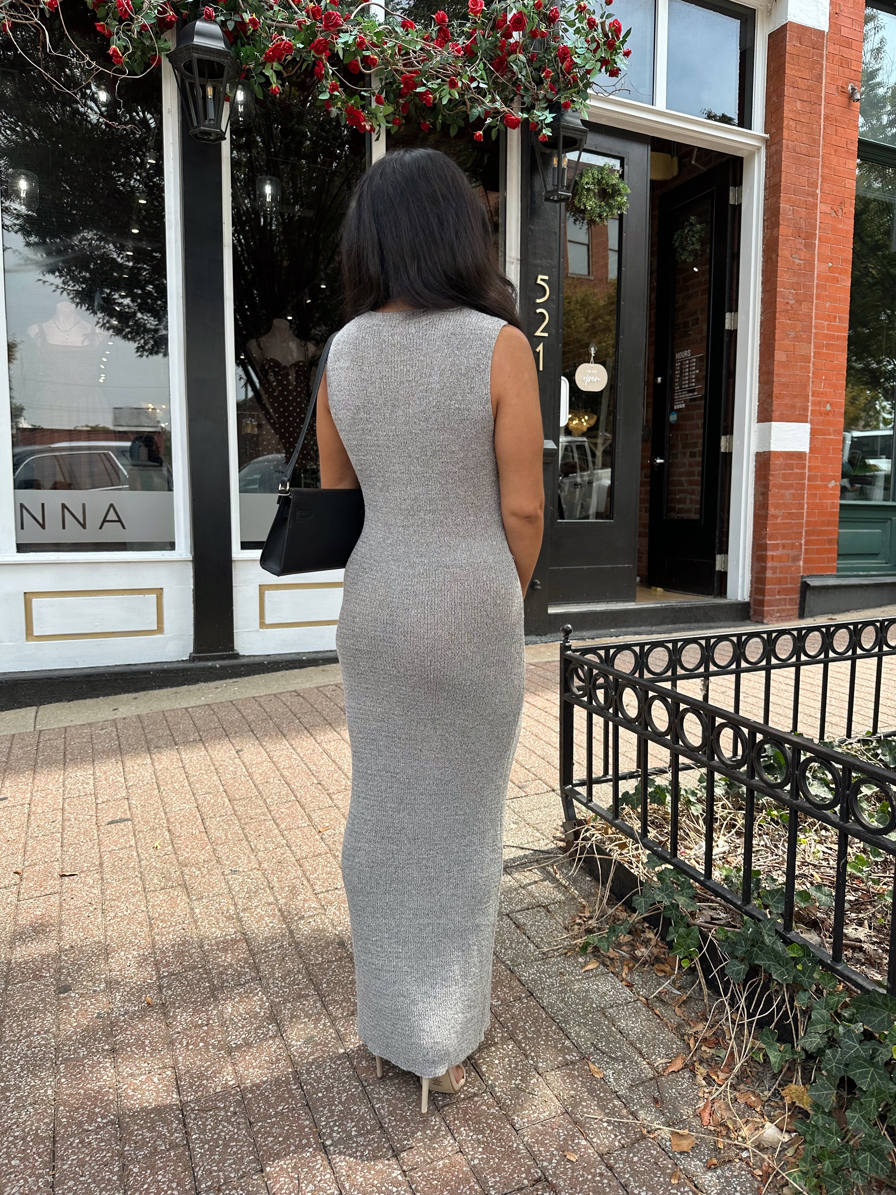 Woman wearing grey knit high neck maxi dress. Plenty of stretch. 