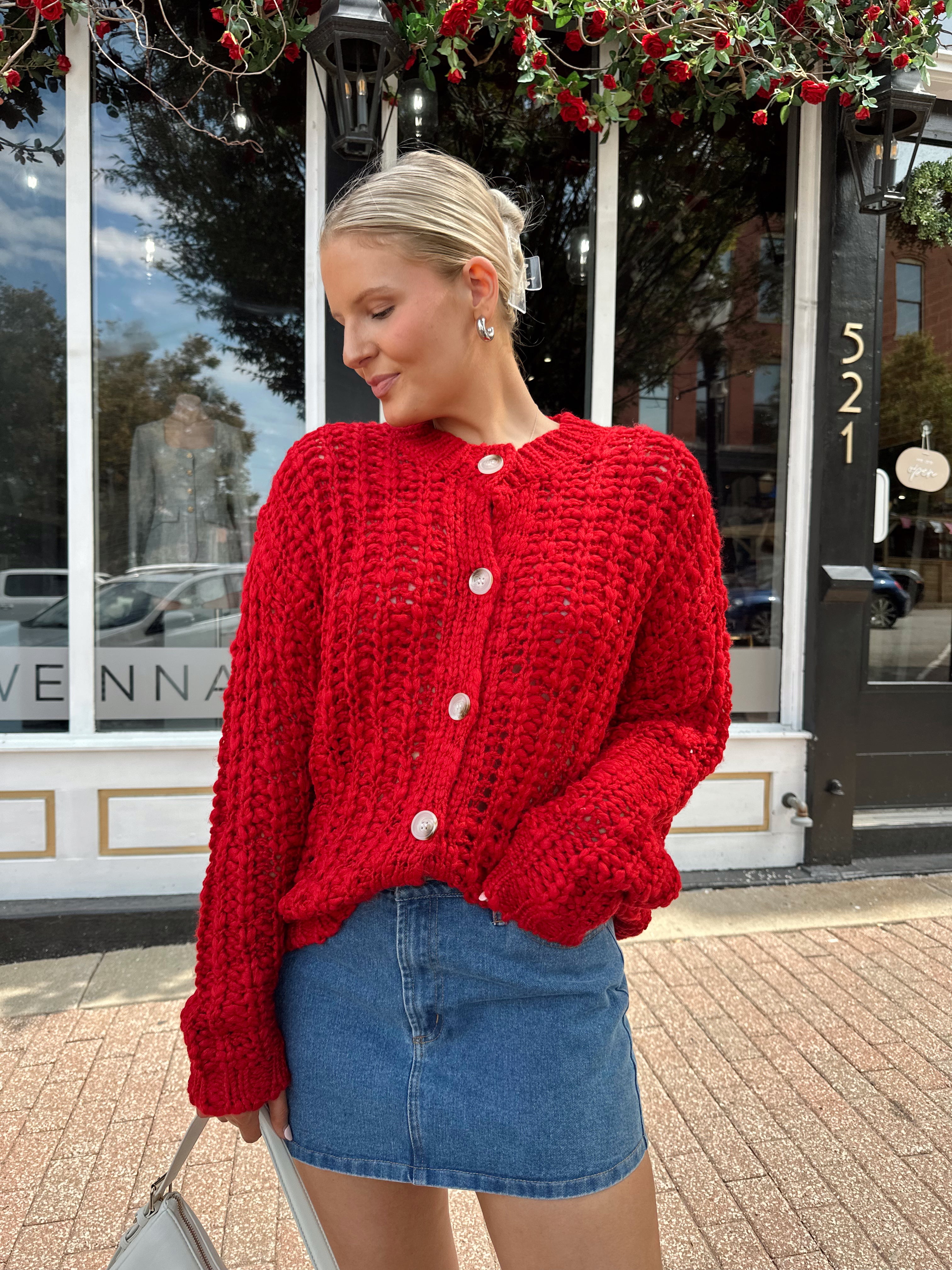 Red chunky knit cardigan with tortoise shell buttons. 