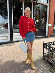 Red chunky knit cardigan with tortoise shell buttons. 