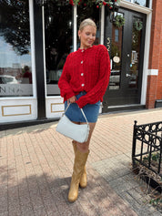 Red chunky knit cardigan with tortoise shell buttons. 