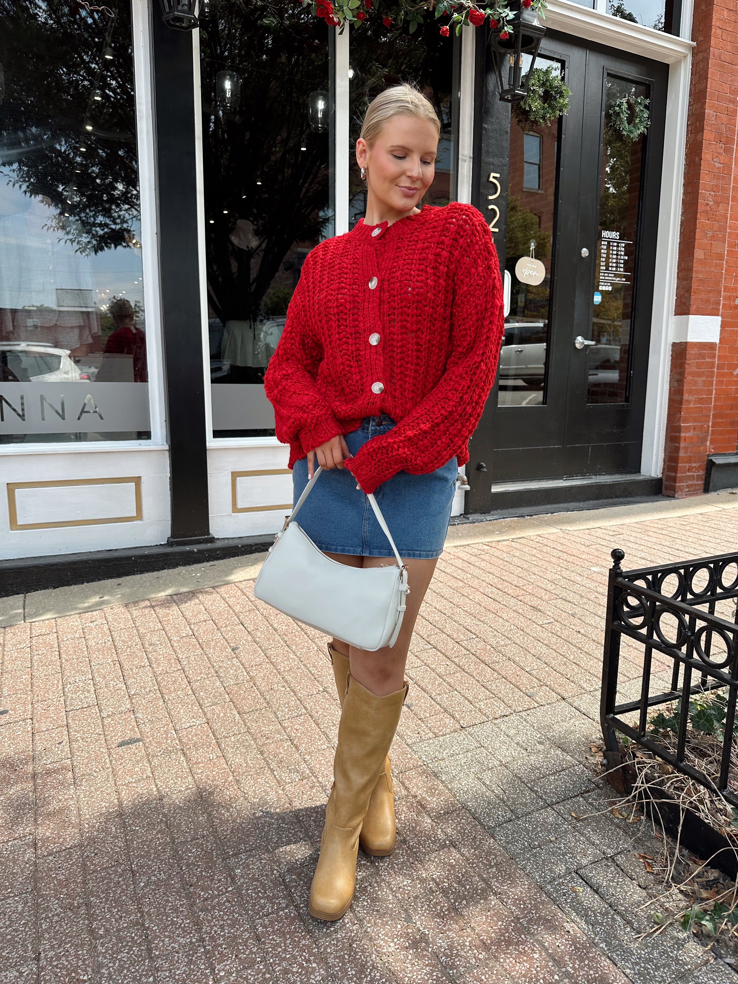 Red chunky knit cardigan with tortoise shell buttons. 