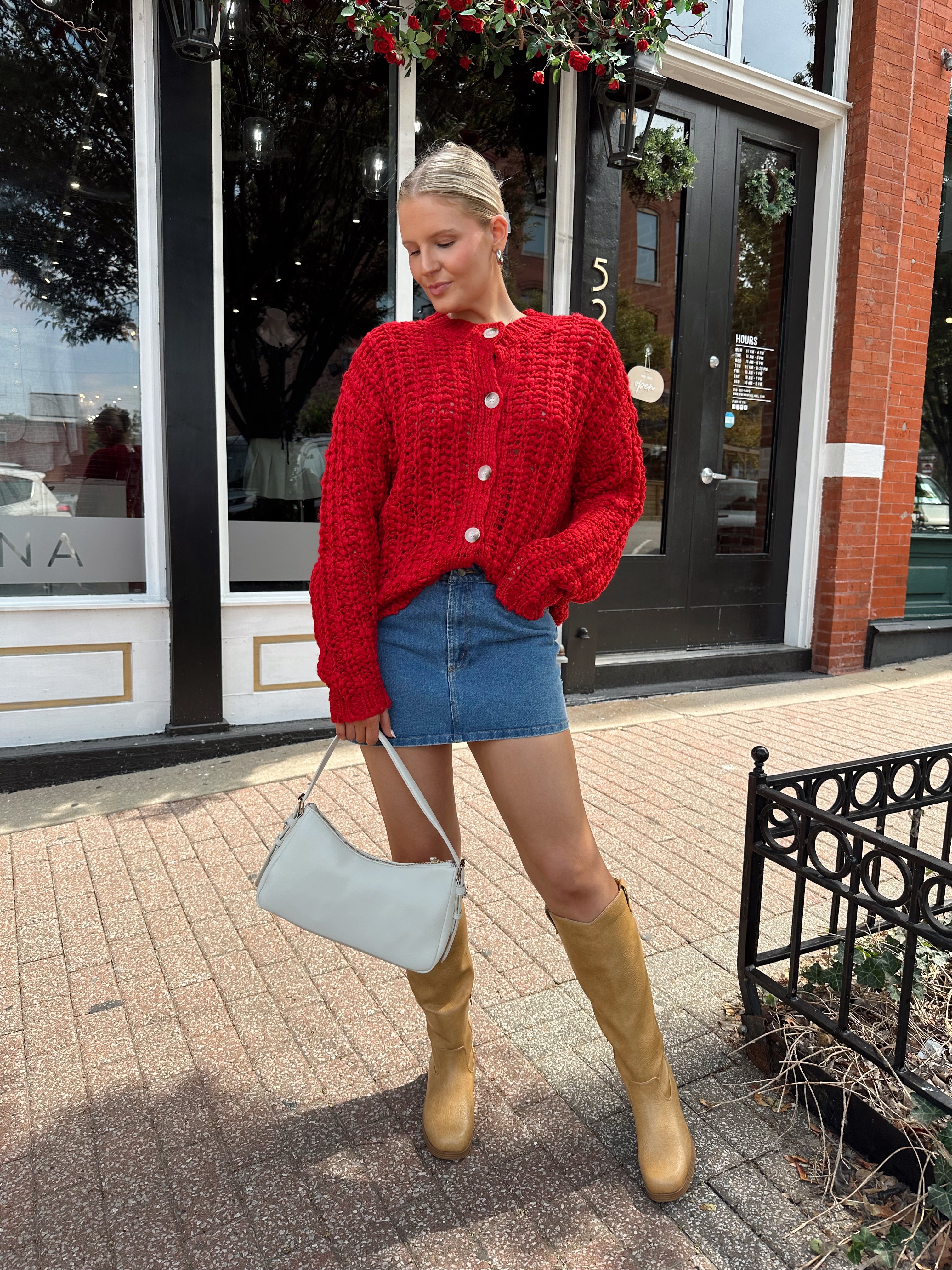 Red chunky knit cardigan with tortoise shell buttons. 